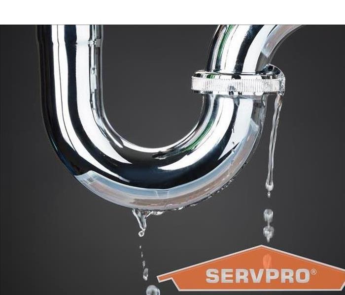 Leaking plumbing pipe with SERVPRO logo